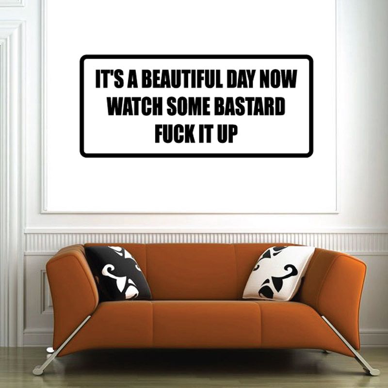 Rectangular wall decal with black border; bold white text: IT'S A BEAUTIFUL DAY NOW WATCH SOME BASTARD