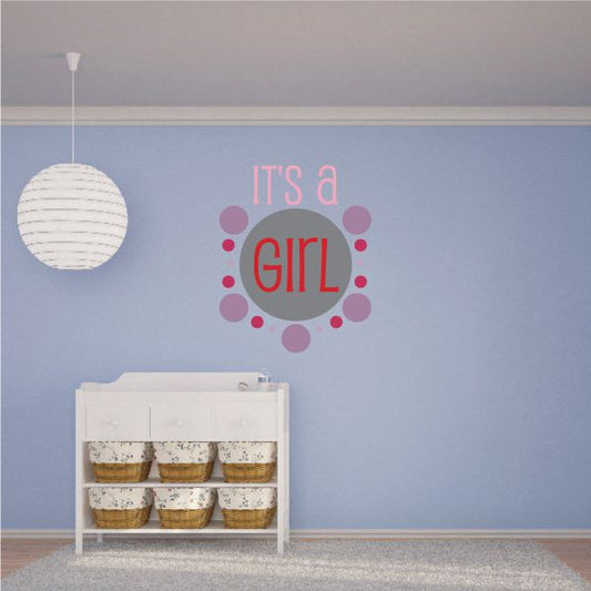 Vinyl wall decal with pink "IT'S a GIRL" lettering in a circular badge