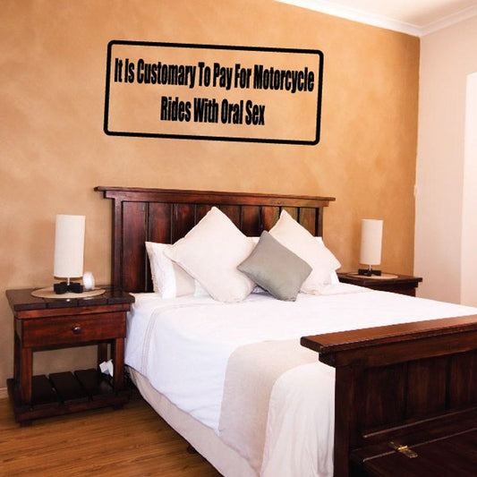 Rectangular black-bordered wall decal with “It's Customary To Pay For Motorcycle Rides With Oral Sex”