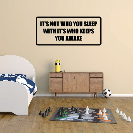 Wall decal with quote: “It’s not who you sleep with, it’s who keeps you awake”