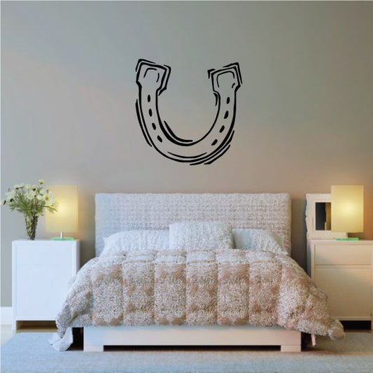 Black horseshoe wall decal with dotted detail and outlined horseshoe shape
