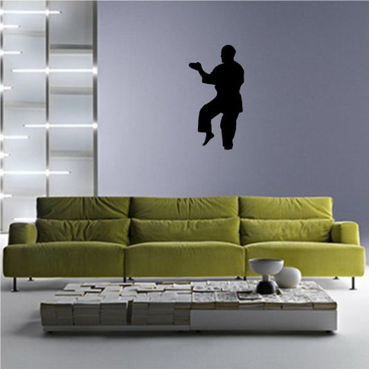 Karate block wall decal with black silhouette of a karate fighter mid-block