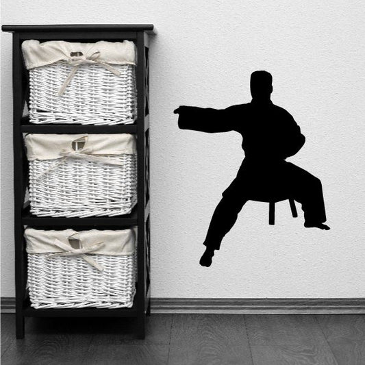 Karate wall decal vinyl sticker with black karate fighter silhouette in a kicking stance