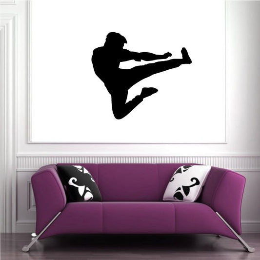 Karate wall decal with black silhouette of kicking martial artist