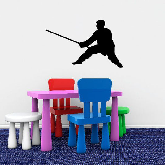 Black karate wall decal silhouette of a kicking martial artist with extended arm