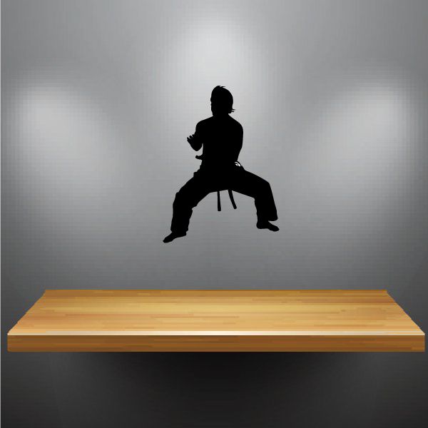 Karate wall decal with black silhouette of fighter in wide crouch stance