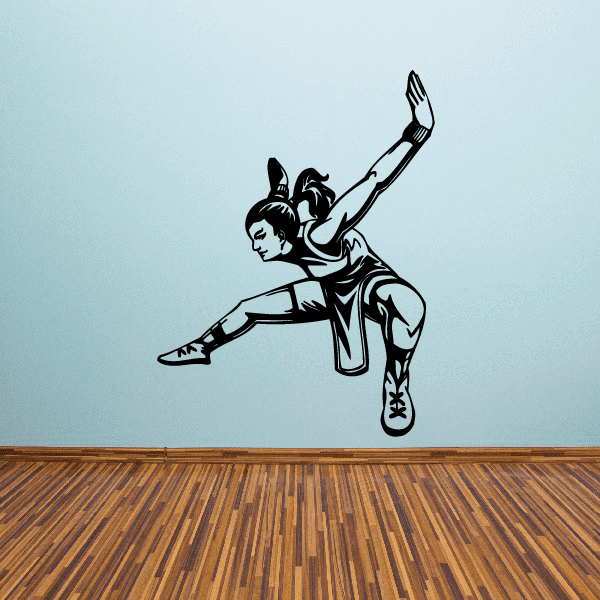 Karate wall decal of a black karate fighter mid-kick, vinyl die-cut sticker
