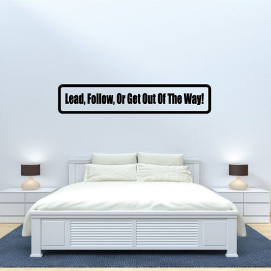 Wall decal with black-outlined label reading 'Lead, Follow, Or Get Out Of The Way'.