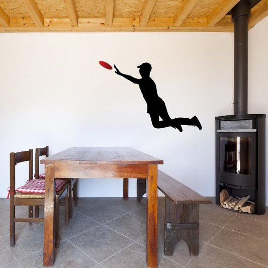 Black leaping frisbee catch decal of a human silhouette with arm extended