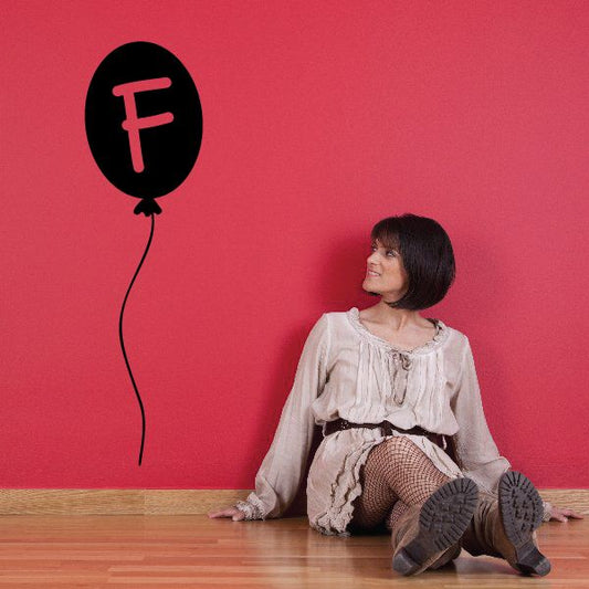 Letter F balloon decal: black balloon with pink letter F.