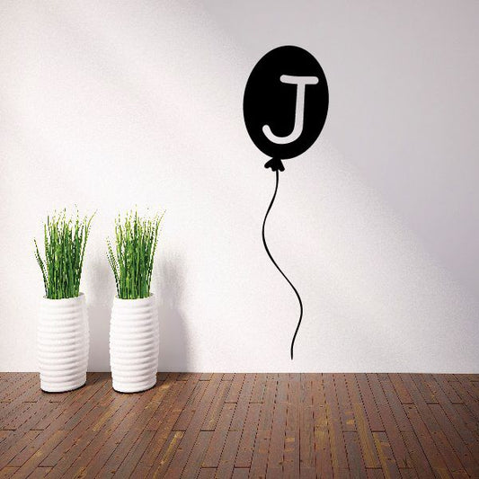Black balloon letter J decal with curly string