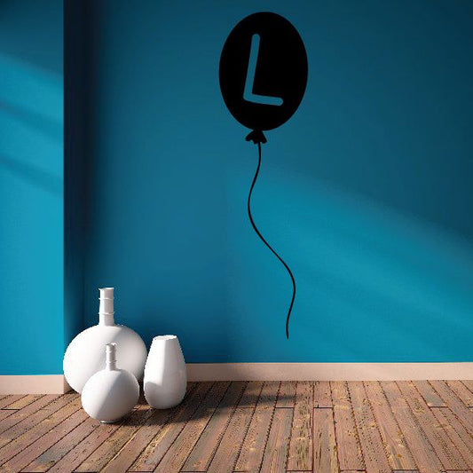 Letter L balloon decoration, black balloon with tall L shape and hanging string
