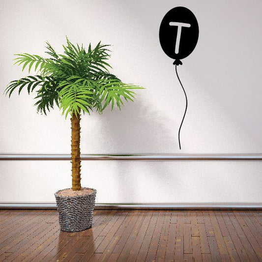Letter T balloon decal: black balloon with white letter T