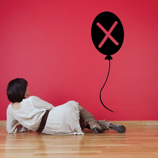 Letter X balloon decal with black balloon and red X icon