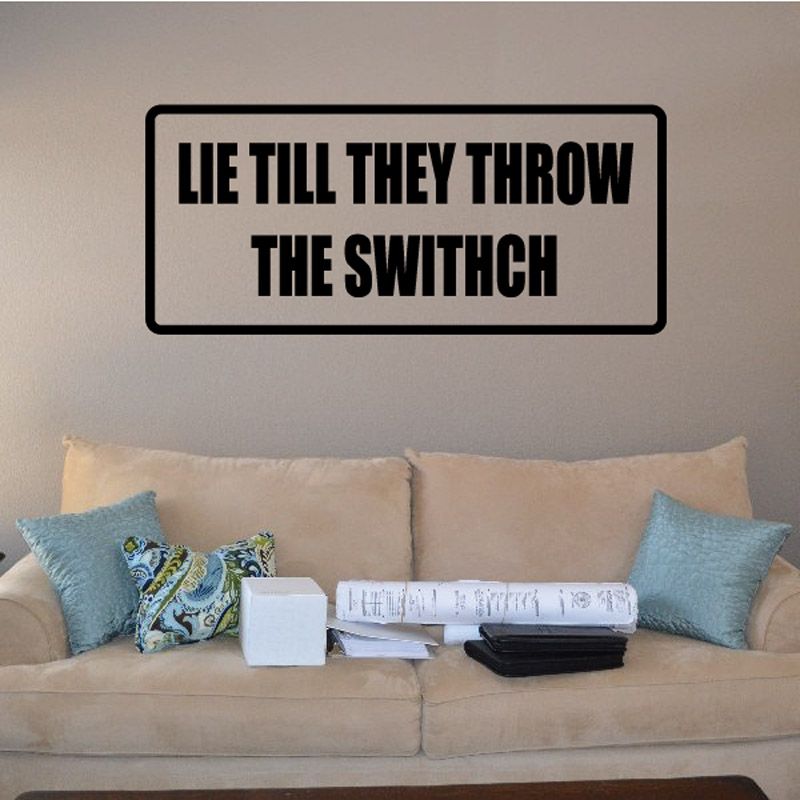 Rectangular wall decal with black border and bold text: LIE TILL THEY THROW THE SWITCH