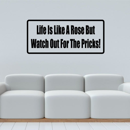 Wall decal with quote text in black on white rectangle with thick border.
