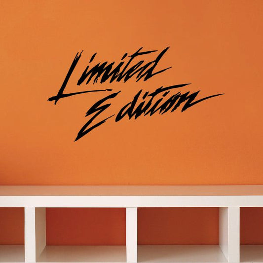 Black stylized Limited Edition decal lettering on orange surface