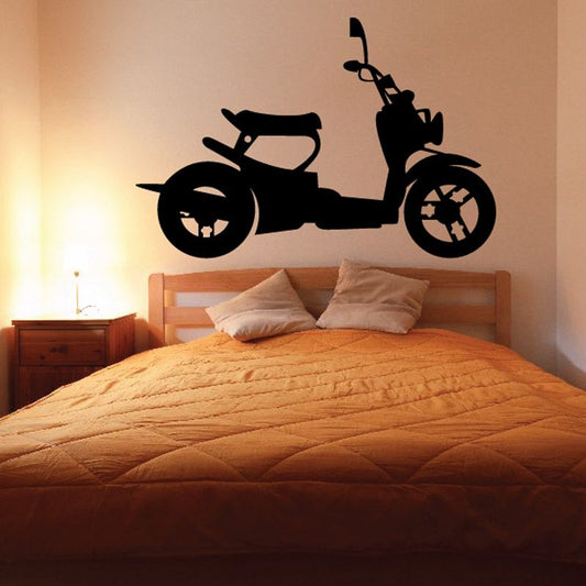 Black scooter wall decal with rider silhouette and detailed wheels