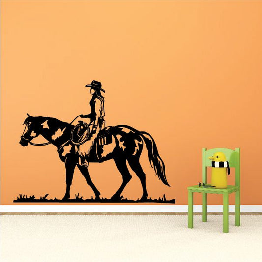 Cowboy riding horse decal, black and tan horse and rider silhouette