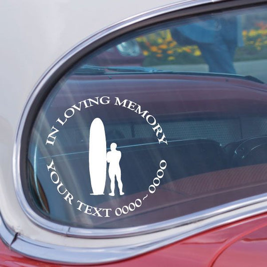 Oval vehicle decal with white silhouette figures and curved 'IN LOVING MEMORY' text