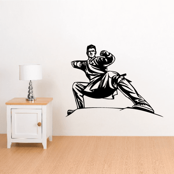 Low stance karate wall decal of a black martial artist in a kneeling pose