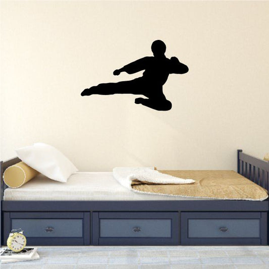 Karate kick wall decal with black silhouette of lunging fighter in side kick pose