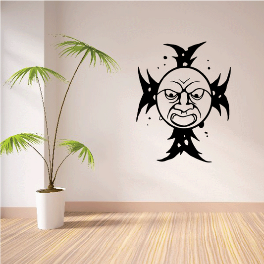 Black moon-cross wall decal with cartoon face and spiky rays, small dot accents