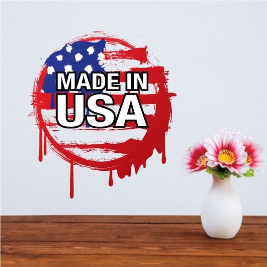 Grunge-style Made in USA sticker with red, white, and blue paint splatter text