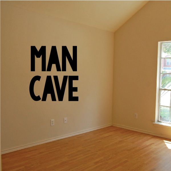 Man cave wall decal with bold black text reading MAN CAVE