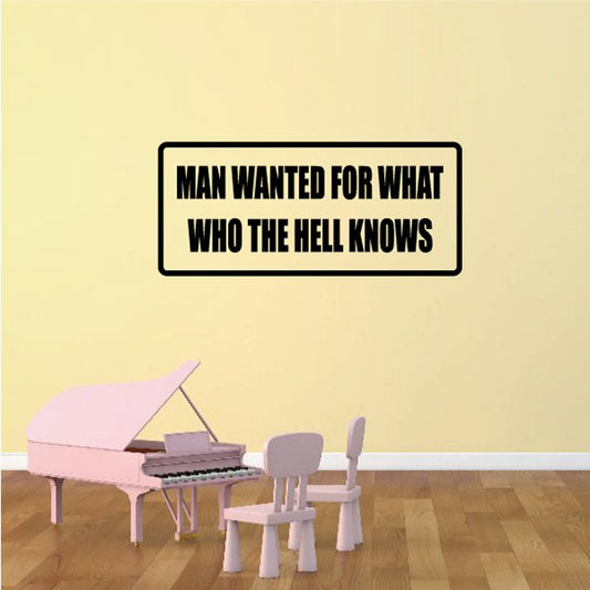 Wall decal reading: MAN WANTED FOR WHAT WHO THE HELL KNOWS