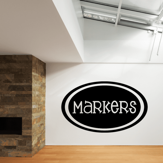 Black oval wall decal with white "Markers" lettering