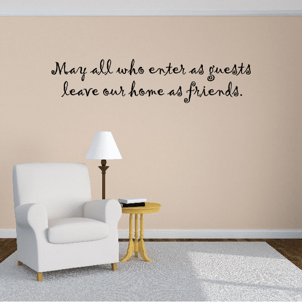 Wall decal with cursive quote: “May all who enter as guests leave our home as friends.”