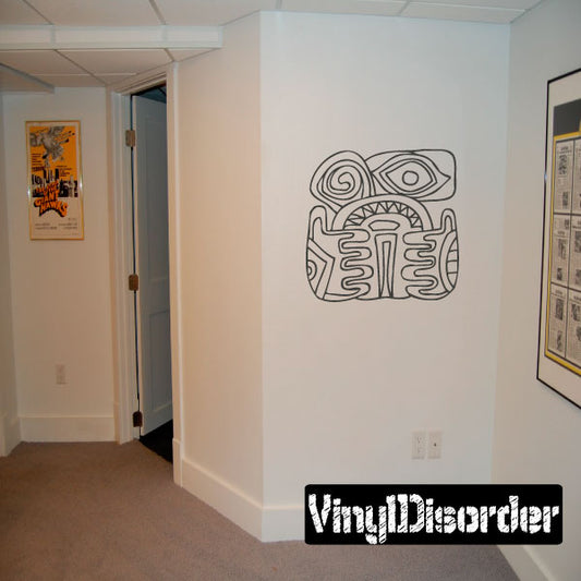 Mayan-style geometric animal head decal in black line art