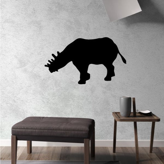 Megacerops decal: black rhino silhouette with horn and raised tail