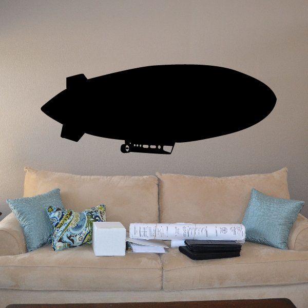 Black blimp wall decal silhouette with small window and fin details