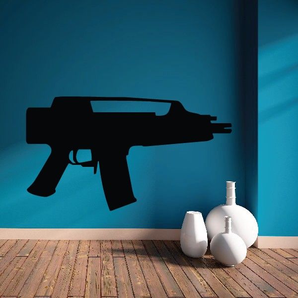 Modern submachine gun decal with dark silhouette of a submachine gun on a wall
