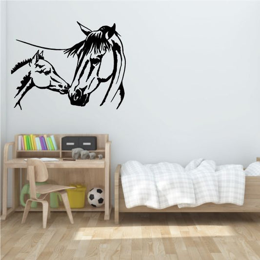 Black horse head kiss wall decal with foal face, outlined design.