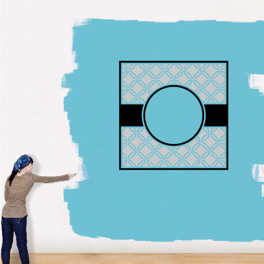 Monogram frame sticker with teal geometric border and central circle window, black outline