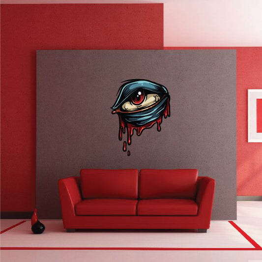 Monster Fist decal featuring a teal monster eye with red iris and dripping accents
