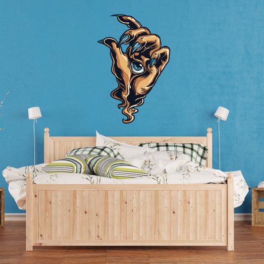 Die-cut decal of a monster hand clutching a cross, dark gold and blue outline