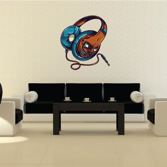 Monster headphones die-cut decal: cartoon monster wearing teal over-ear headphones