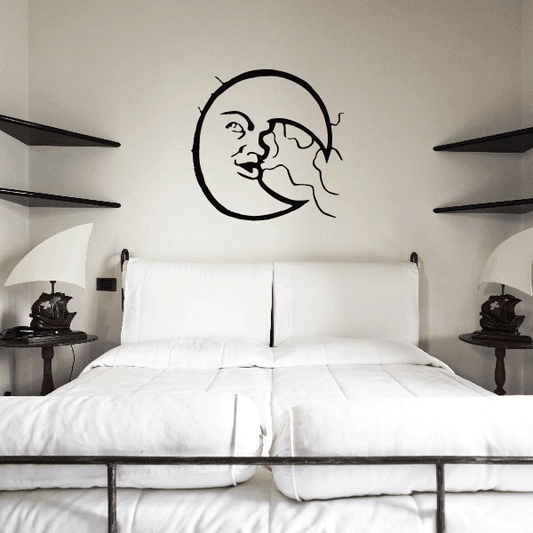 Black line-art moon and clouds wall decal, round face with flowing cloud stream