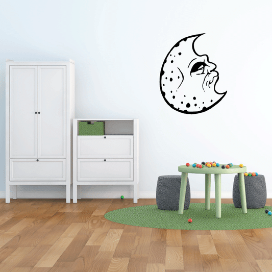 Crescent moon cookie decal with dotted sprinkles and a smiling face