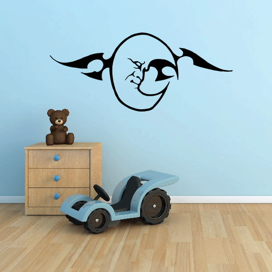 Moon wall decal with black smiling face, rounded outline, and curving rays