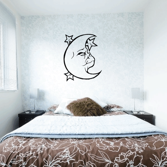 Moon and stars wall decal with line-art face in crescent, black outline
