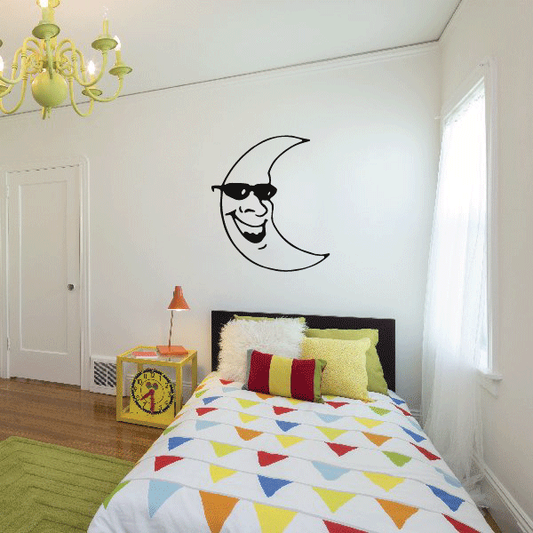 Moon decal with black smiling face and glasses