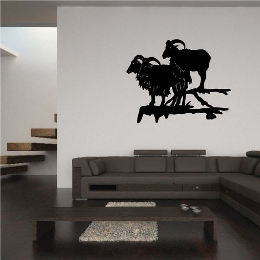 Mountain goats on cliff decal, black silhouette of two goats standing on rocky ledge