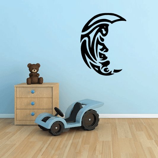 Crescent moon wall decal with multiple faces in black