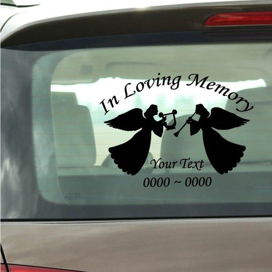 Car memorial decal with two black angel silhouettes and 'In Loving Memory' text