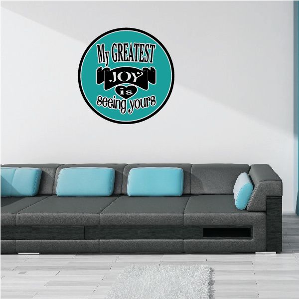 Round teal sticker with black text: "My greatest joy is seeing yours"